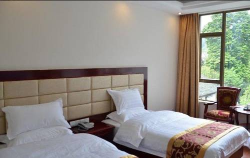 Imagen de la habitación del Hotel Emeishan Donghui Grand Hotel. Foto 2