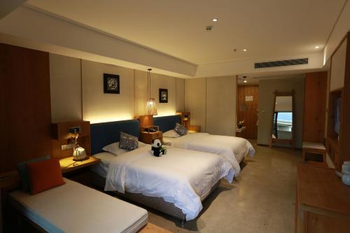 Imagen de la habitación del Hotel Emeishan Qiliping Peninsula. Foto 7