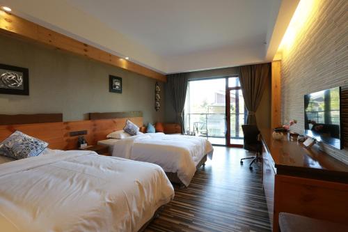 Imagen de la habitación del Hotel Emeishan Qiliping Peninsula. Foto 9