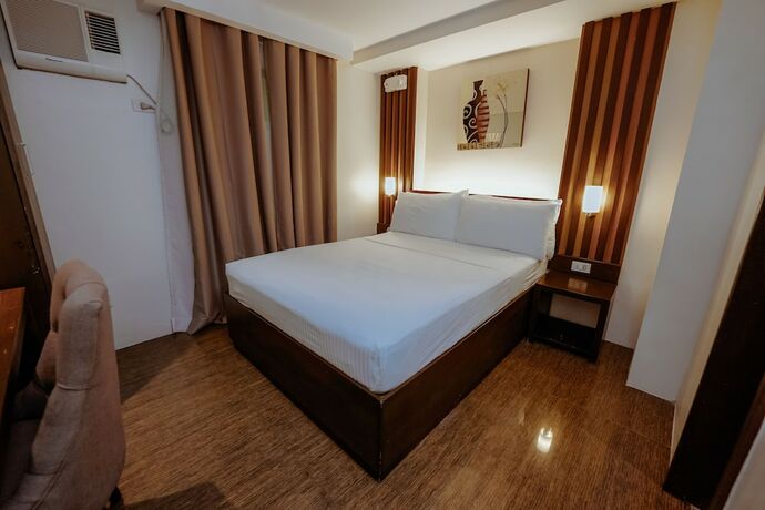 Imagen de la habitación del Hotel Emerald Boutique. Foto 16