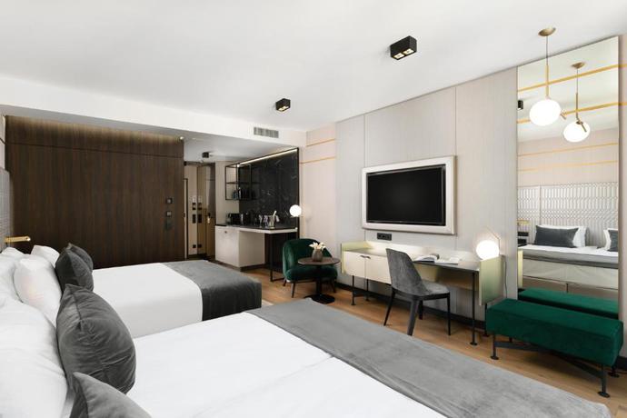 Imagen de la habitación del Hotel Emerald Downtown Suites. Foto 4