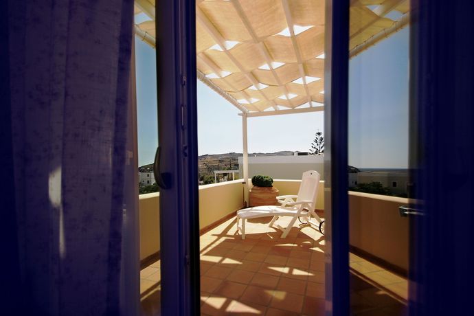 Imagen de la habitación del Hotel Emilia Luxury Apartments. Foto 11