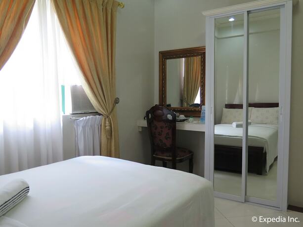 Imagen de la habitación del Hotel Emiramona Garden Hotel. Foto 9