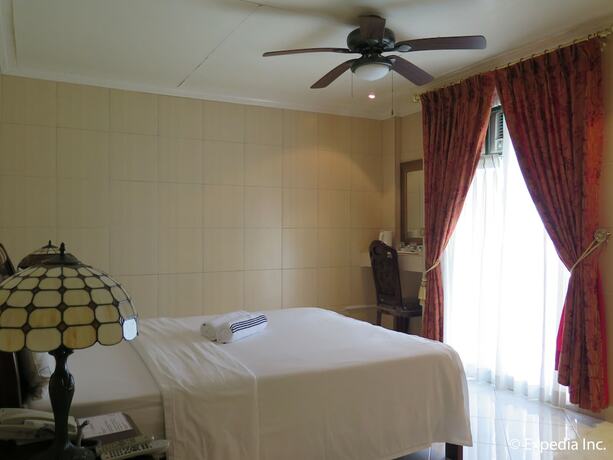 Imagen de la habitación del Hotel Emiramona Garden Hotel. Foto 10