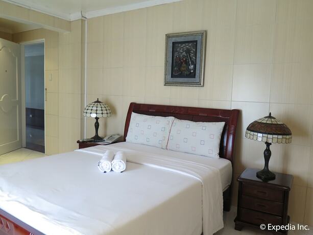 Imagen de la habitación del Hotel Emiramona Garden Hotel. Foto 12