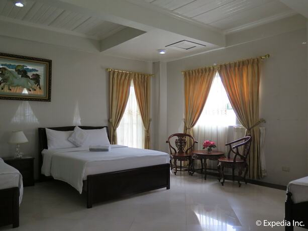 Imagen de la habitación del Hotel Emiramona Garden Hotel. Foto 15