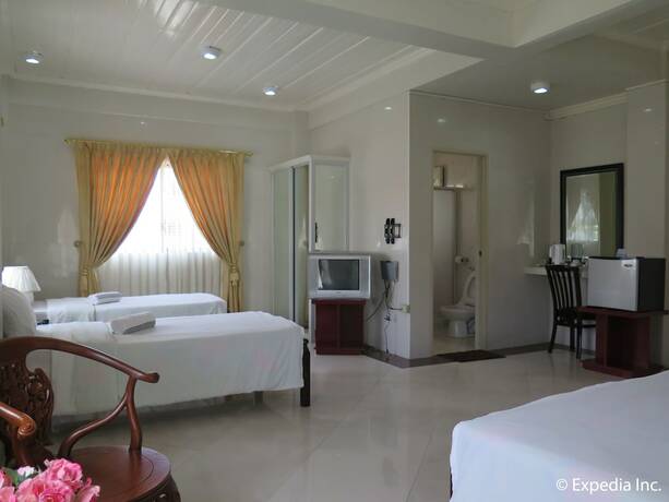 Imagen de la habitación del Hotel Emiramona Garden Hotel. Foto 16