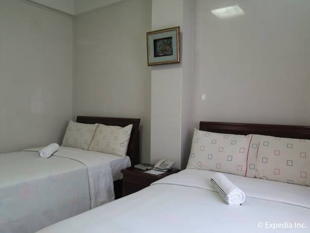 Imagen de la habitación del Hotel Emiramona Garden Hotel. Foto 17