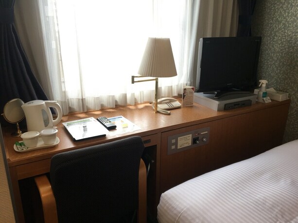 Imagen de la habitación del Hotel Emisia Tokyo Tachikawa. Foto 14