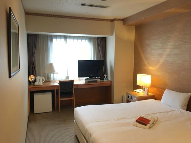Imagen de la habitación del Hotel Emisia Tokyo Tachikawa. Foto 17