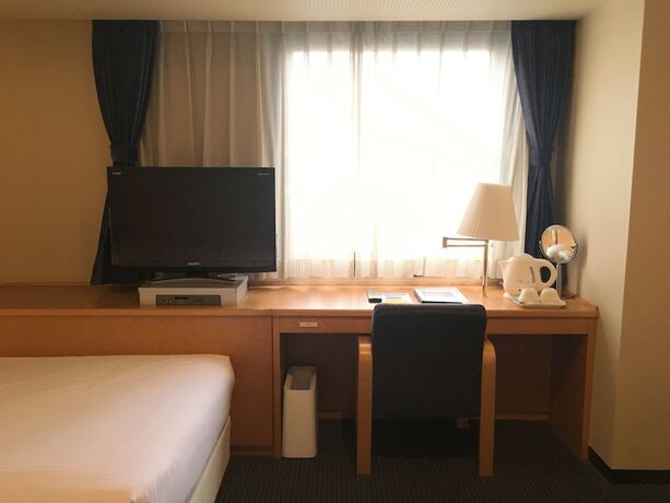 Imagen de la habitación del Hotel Emisia Tokyo Tachikawa. Foto 21