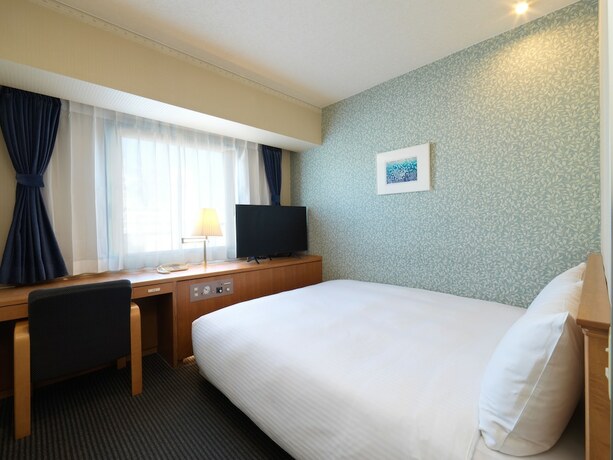 Imagen de la habitación del Hotel Emisia Tokyo Tachikawa. Foto 22