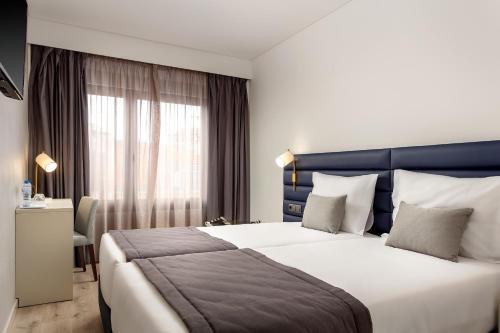 Imagen de la habitación del Hotel Empire Marquês. Foto 16