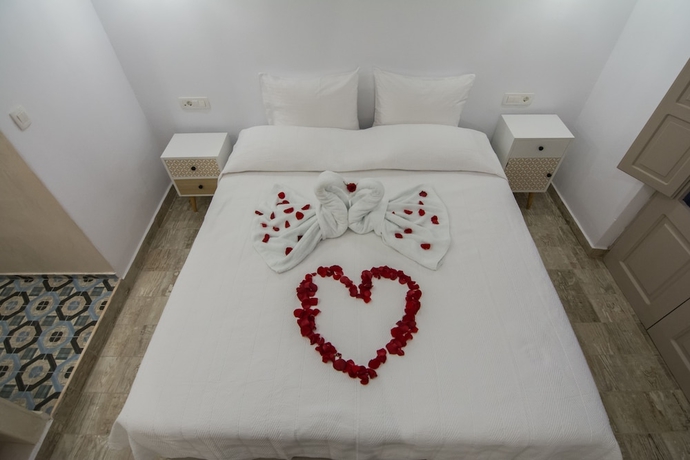 Imagen de la habitación del Hotel En Plo Boutique Suites. Foto 11