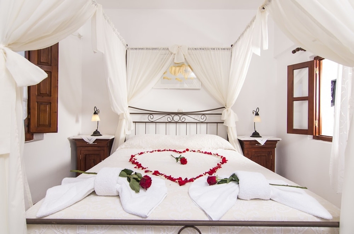 Imagen de la habitación del Hotel En Plo Boutique Suites. Foto 13