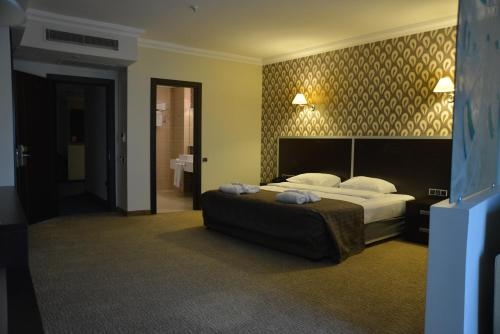 Imagen de la habitación del Hotel Ener Old Castle Resort. Foto 7