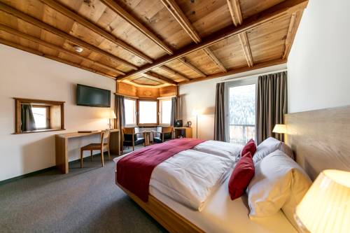 Imagen de la habitación del Hotel Engadiner Boutique-hotel Guardaval. Foto 7