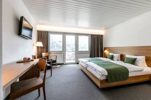 Imagen de la habitación del Hotel Engadiner Boutique-hotel Guardaval. Foto 10