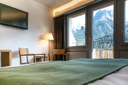 Imagen de la habitación del Hotel Engadiner Boutique-hotel Guardaval. Foto 13