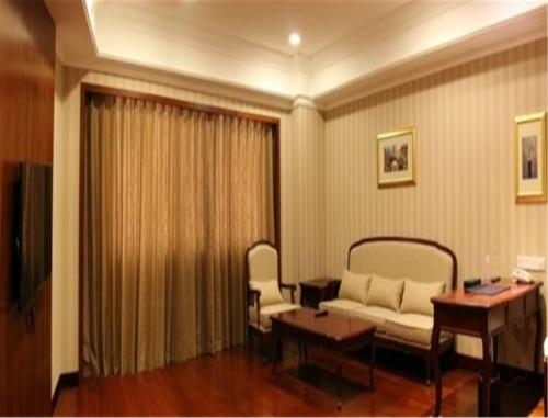 Imagen de la habitación del Hotel Enrichee Gloria Plaza Qingdao. Foto 8