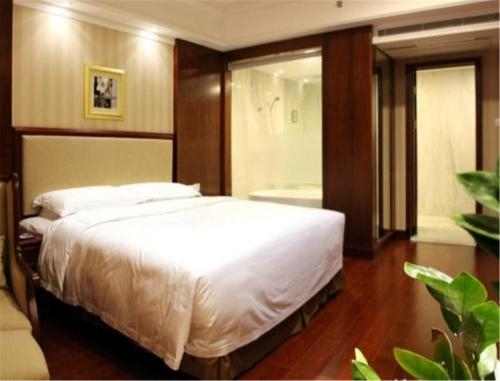 Imagen de la habitación del Hotel Enrichee Gloria Plaza Qingdao. Foto 10