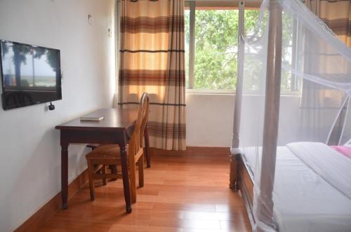 Imagen de la habitación del Hotel Entebbe Flights Motel. Foto 18