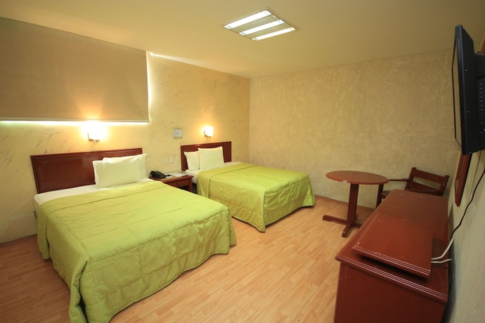 Imagen de la habitación del Hotel Enterprise Inn Plaza. Foto 8