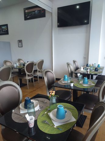 Imagen del bar/restaurante del Hotel Enzos Limoges Centre Jourdan By Kyriad Direct. Foto 1