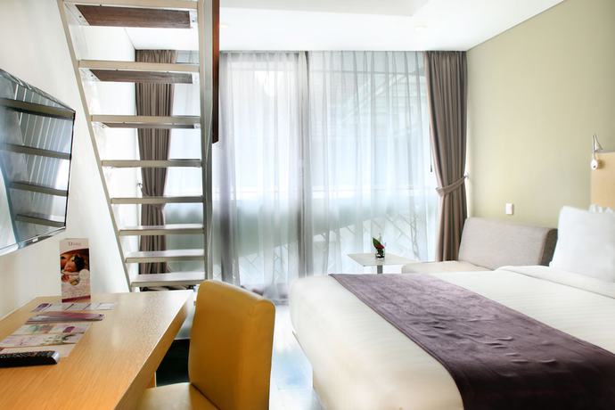 Imagen de la habitación del Hotel Episode Kuta Bali. Foto 14