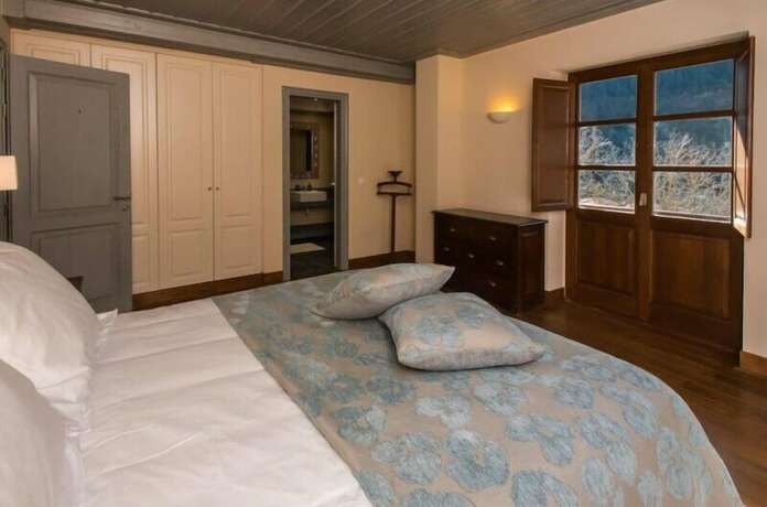 Imagen de la habitación del Hotel Epoches Luxury Suites. Foto 15
