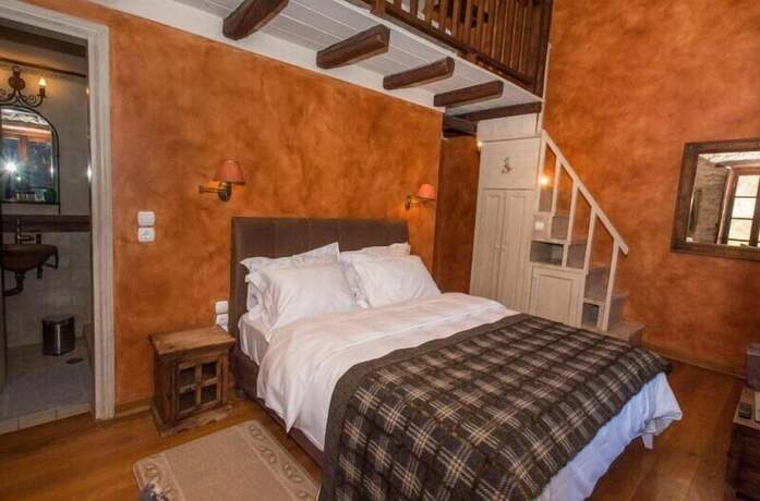 Imagen de la habitación del Hotel Epoches Luxury Suites. Foto 18