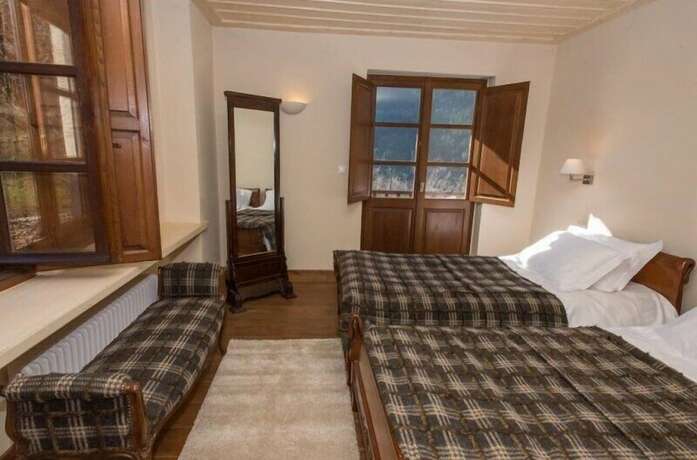 Imagen de la habitación del Hotel Epoches Luxury Suites. Foto 19
