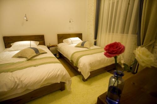 Imagen de la habitación del Hotel Erhai Gate No.1. Foto 8