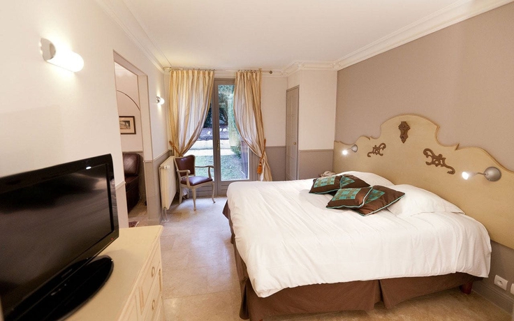 Imagen de la habitación del Hotel Ermitage De Corton. Foto 15