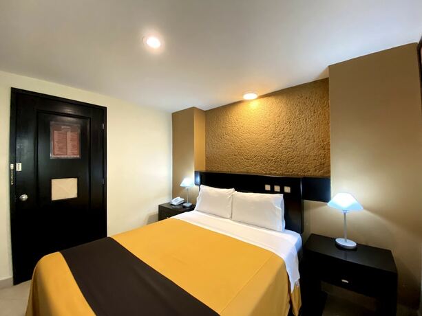 Imagen de la habitación del Hotel Escala Puebla Centro. Foto 16