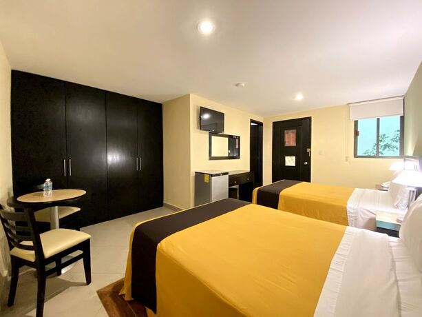 Imagen de la habitación del Hotel Escala Puebla Centro. Foto 18