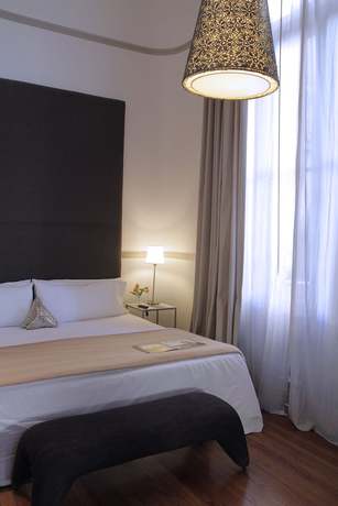 Imagen de la habitación del Hotel Esplendor By Wyndham Savoy Rosario. Foto 3