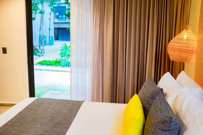 Imagen de la habitación del Hotel Esplendor By Wyndham Tulum Nook. Foto 4