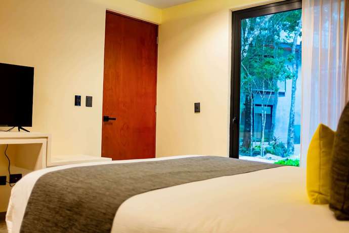 Imagen de la habitación del Hotel Esplendor By Wyndham Tulum Nook. Foto 6