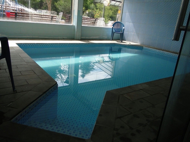 Imagen de la piscina del Hotel Est&acirc;ncia, Po&ccedil;os de Caldas. Foto 16