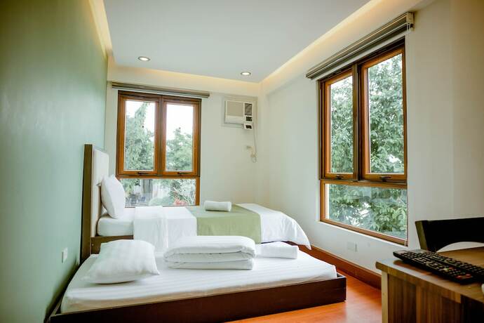 Imagen de la habitación del Hotel Estancia De Lorenzo Tarlac. Foto 19