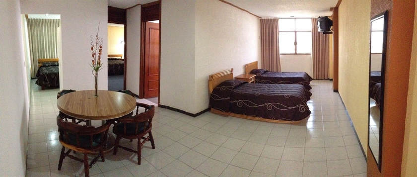 Imagen de la habitación del Hotel Estanza and Suites. Foto 2