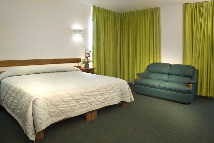 Imagen de la habitación del Hotel Estanza and Suites. Foto 5