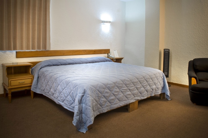 Imagen de la habitación del Hotel Estanza and Suites. Foto 6