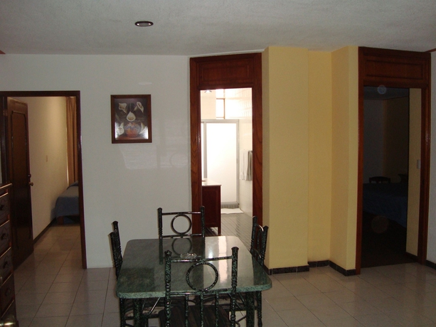 Imagen de la habitación del Hotel Estanza and Suites. Foto 8