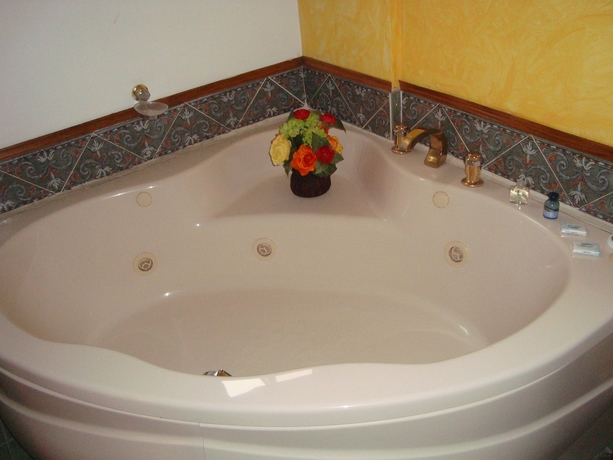 Imagen de la habitación del Hotel Estanza and Suites. Foto 9