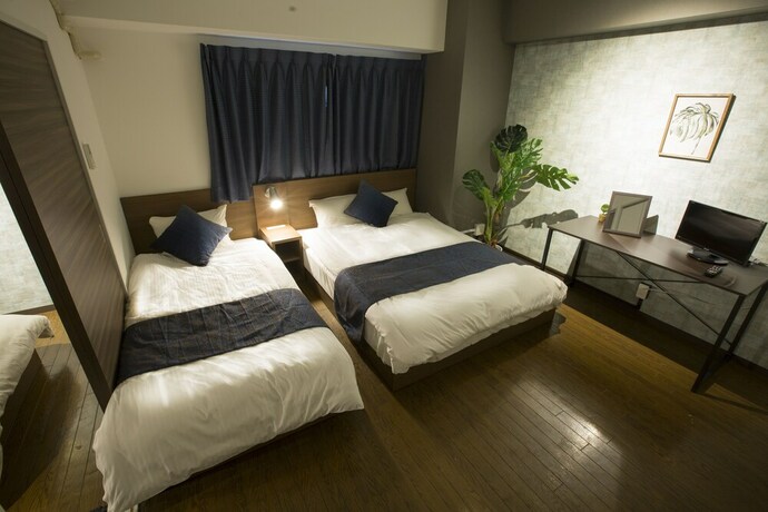 Imagen de la habitación del Hotel E-stay Namba. Foto 16