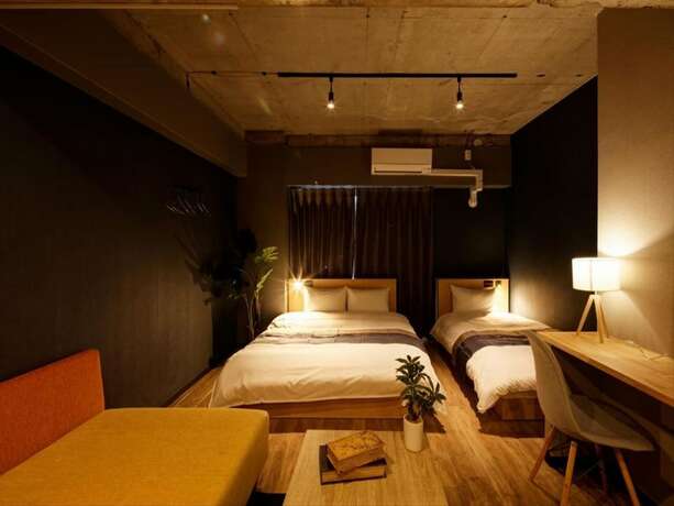 Imagen de la habitación del Hotel E-stay Namba. Foto 22