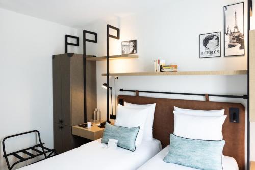 Imagen de la habitación del Hotel Esteem Tour Eiffel. Foto 14