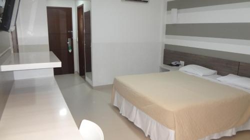 Imagen de la habitación del Hotel Esuites Vale Dos Carajás. Foto 7